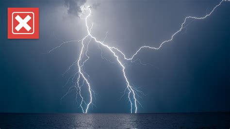 Is it safe to swim indoors during a thunderstorm, and does the chlorine in the water attract lightning?